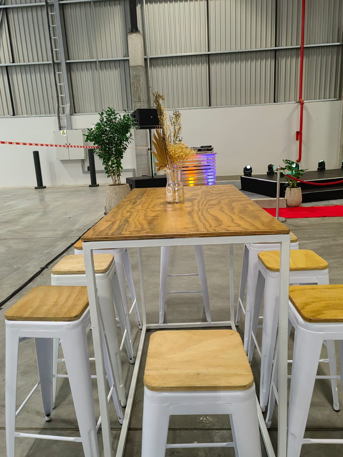 Wood-top bar tables with white stools