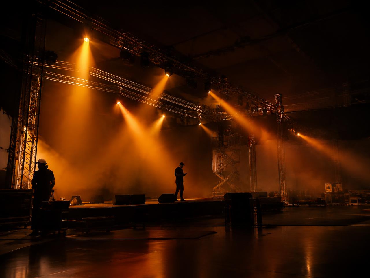 Crew rigging an event build